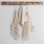 Set of three organic cotton produce bags on wooden hooks