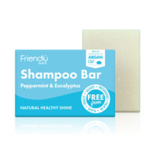 Bar of peppermint & eucalyptus shampoo behind cardboard box packaging.