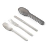 Picture of the Travel Cutlery Set by Black+Blum: a spoon, a fork and a knife made of stainless steel laid out next to a grey case