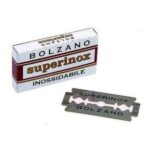 Small cardboard box with one double edge razor blade in front