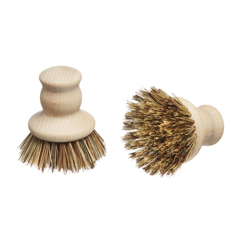 wooden-pot-brush Wooden pot brush standing on it's end and another laying on it's side.