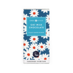 Attractive packaging for Oat Milk chocolate with foil wrapper and blue paper outer with daisies on