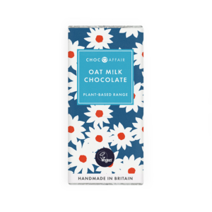 Attractive packaging for Oat Milk chocolate with foil wrapper and blue paper outer with daisies on