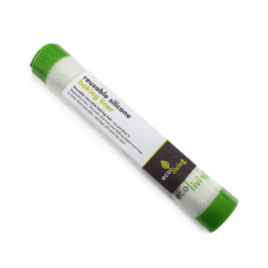Silicone mat with green edges, rolled up in a cardboard outer.