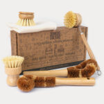 Cardboard box with the various brushes and cloth positioned around
