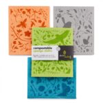 Four different designs of birds and floral print on different coloured sponge cloths with paper label