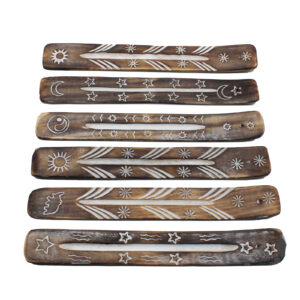 A range of attractive white washed wooden ash catchers for incense sticks. Different designs including an elephant, star, sun, yin yang and moon.