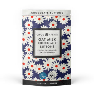 Oat milk chocolate buttons in attractive blue paper pouch with daisies on.